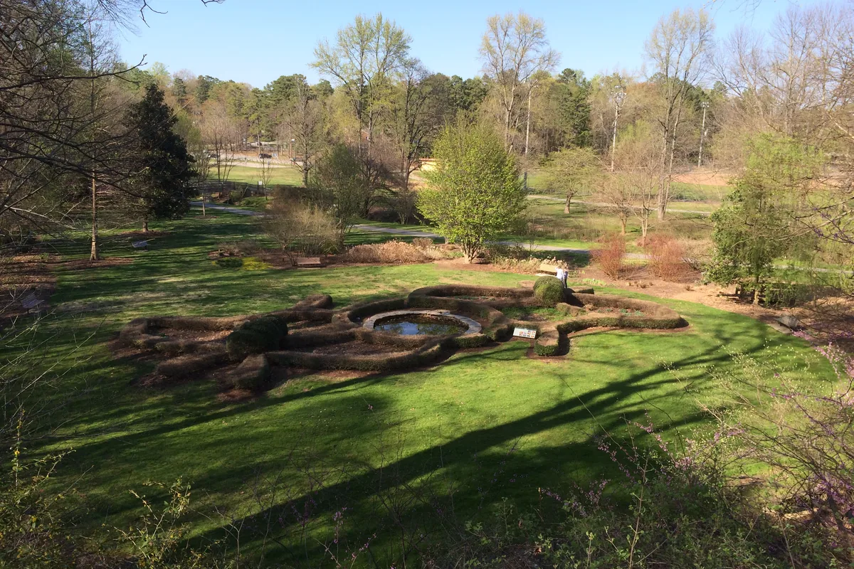 Butterfly garden hedges and pond at the Greensboro Arboretum